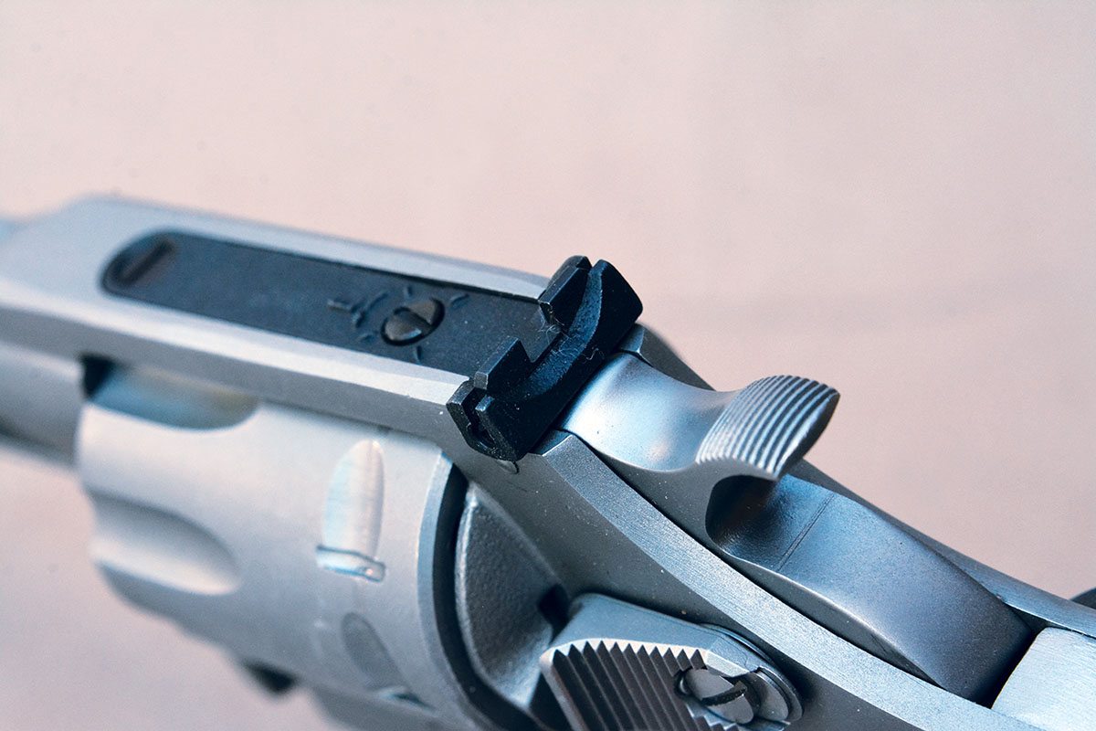 The rear sight is adjustable for windage and elevation.